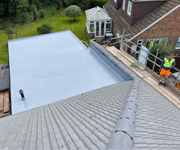 This is a photo of a newly installed hip roof, with a combined liquid covered flat roof. Work carried out by KJI Roofing Rothwell