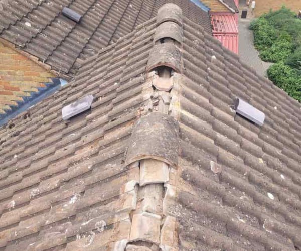 This is a photo if a roof ridge which has missing tiles. The ridge tiles are being replaced by KJI Roofing Rothwell